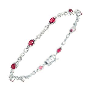 14K WG 1/4 ct. tw. Diamond & 1 5/8 ct. tw. Oval Cut Ruby Station Bracelet