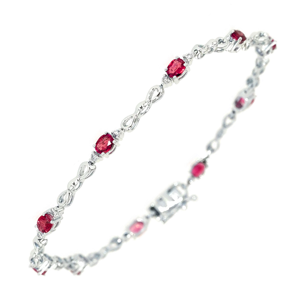 14K WG 1/4 ct. tw. Diamond & 1 5/8 ct. tw. Oval Cut Ruby Station Bracelet